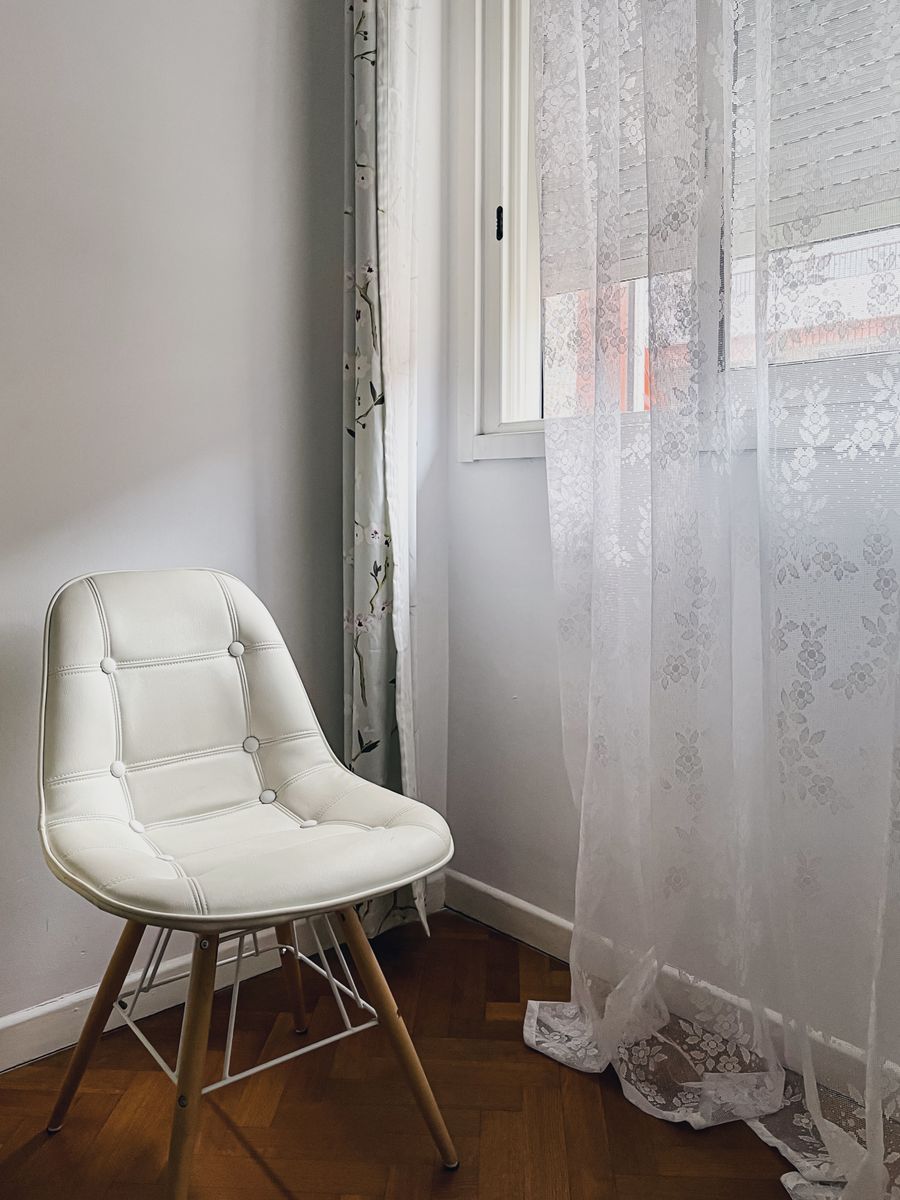 White accent chair in a homeware storefront example